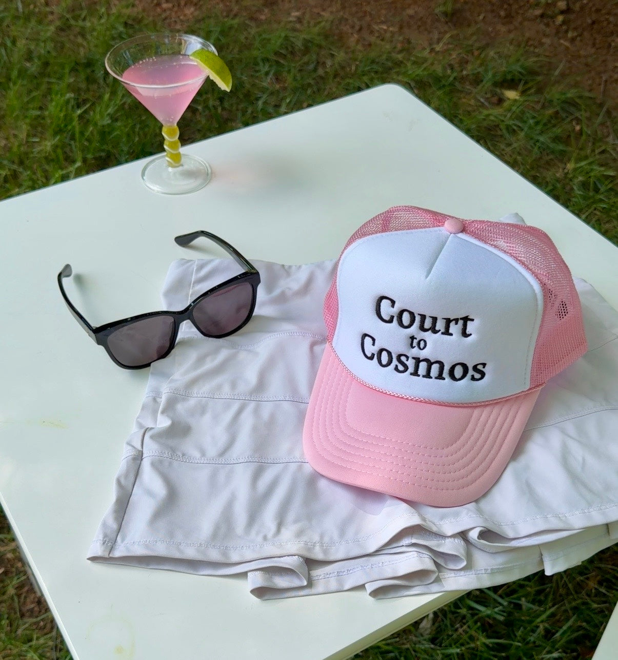 Court to Cosmos trucker hat