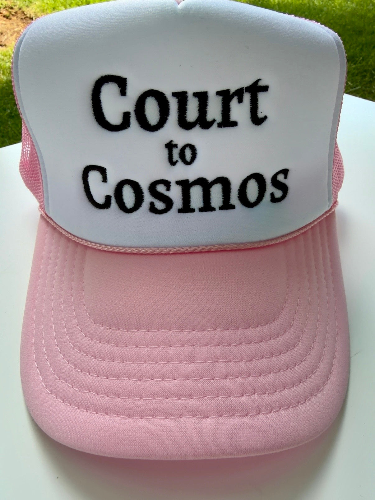 Court to Cosmos trucker hat